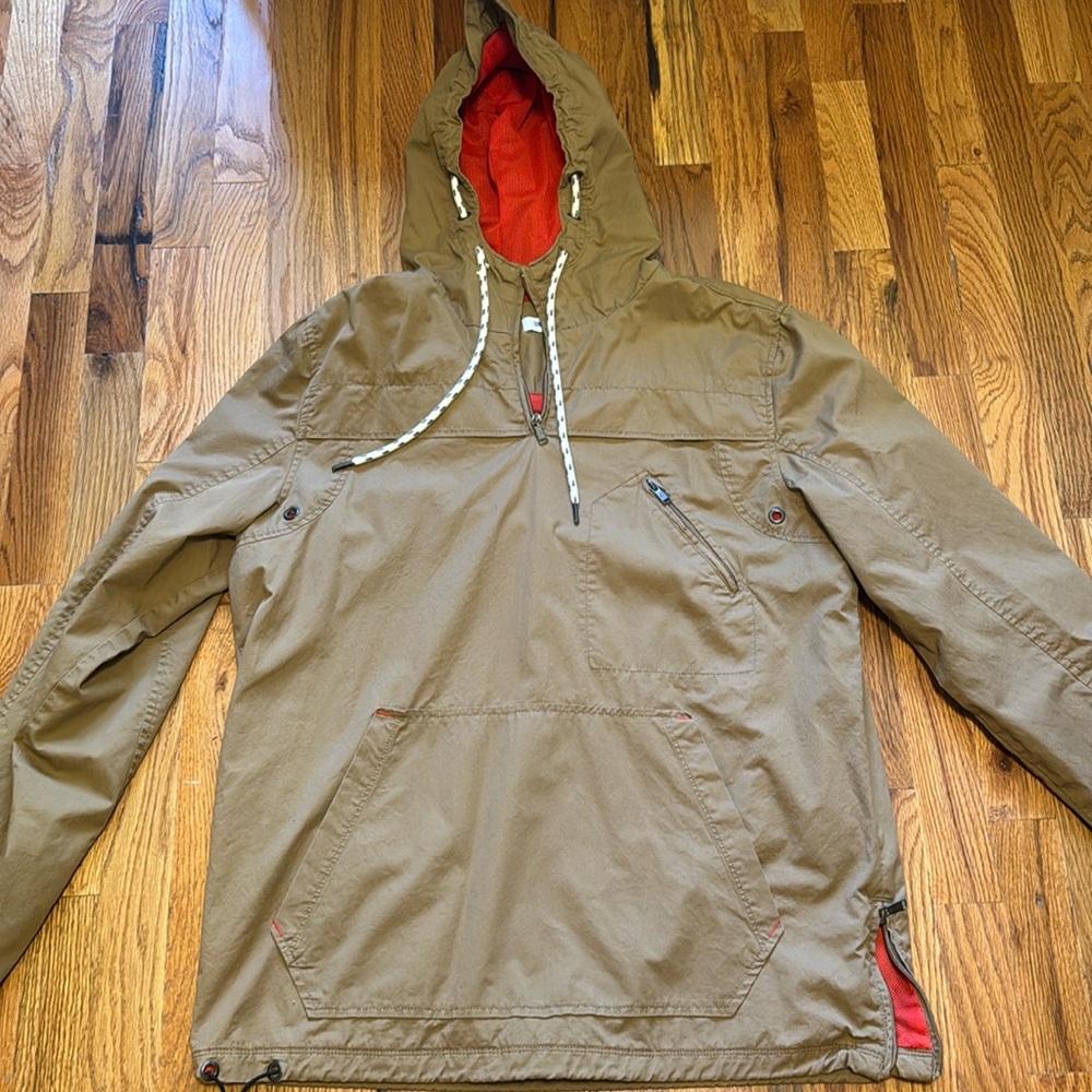 Tan wind breaker.